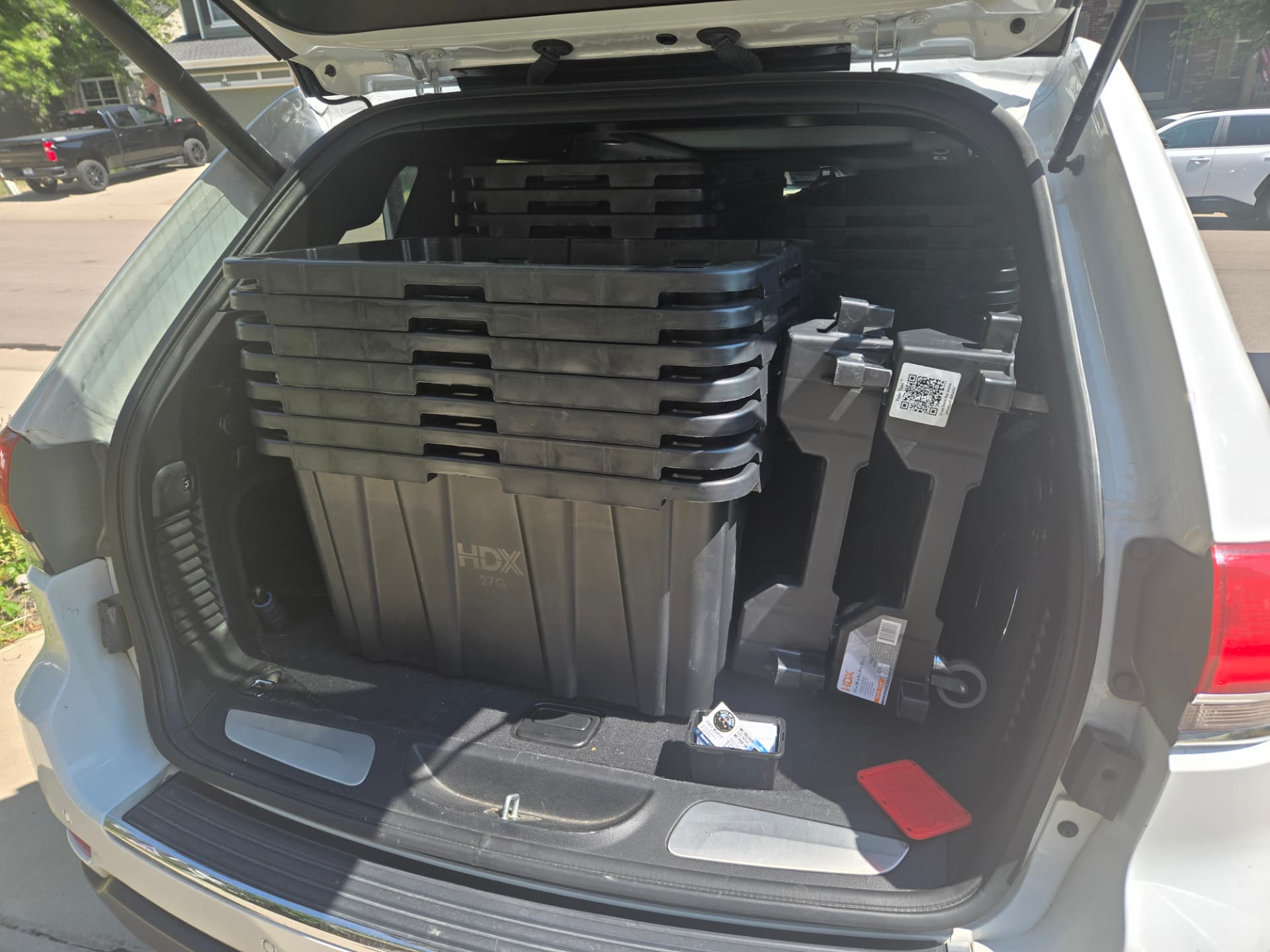 Empty reusable moving totes loaded for pickup after a Denver move